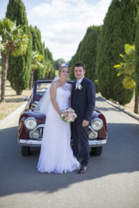 arrivee des maries a la reception au chateau lafitte laguens yvrac allee Sebastien Huruguen Photographe Mariage Bordeaux